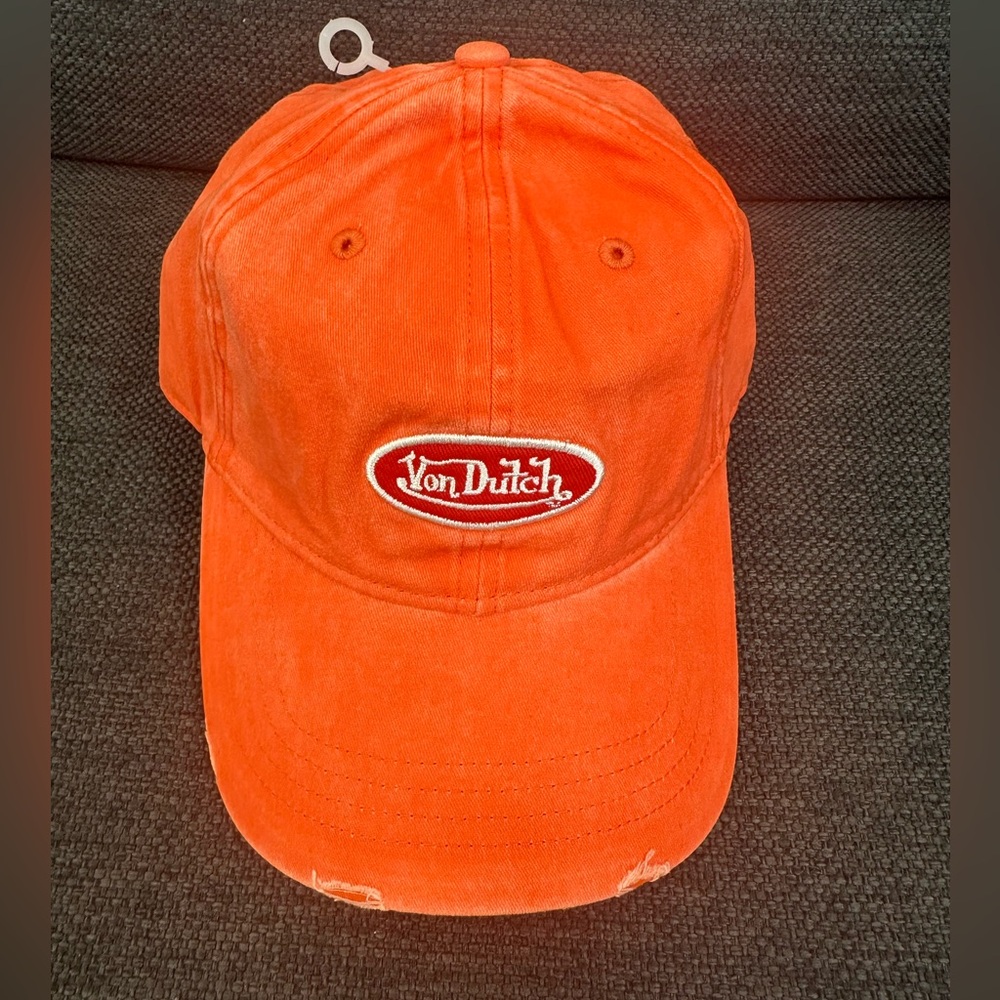 NWT Von Dutch Distressed Orange Classic Trucker Hat
Adjustable snapback closure